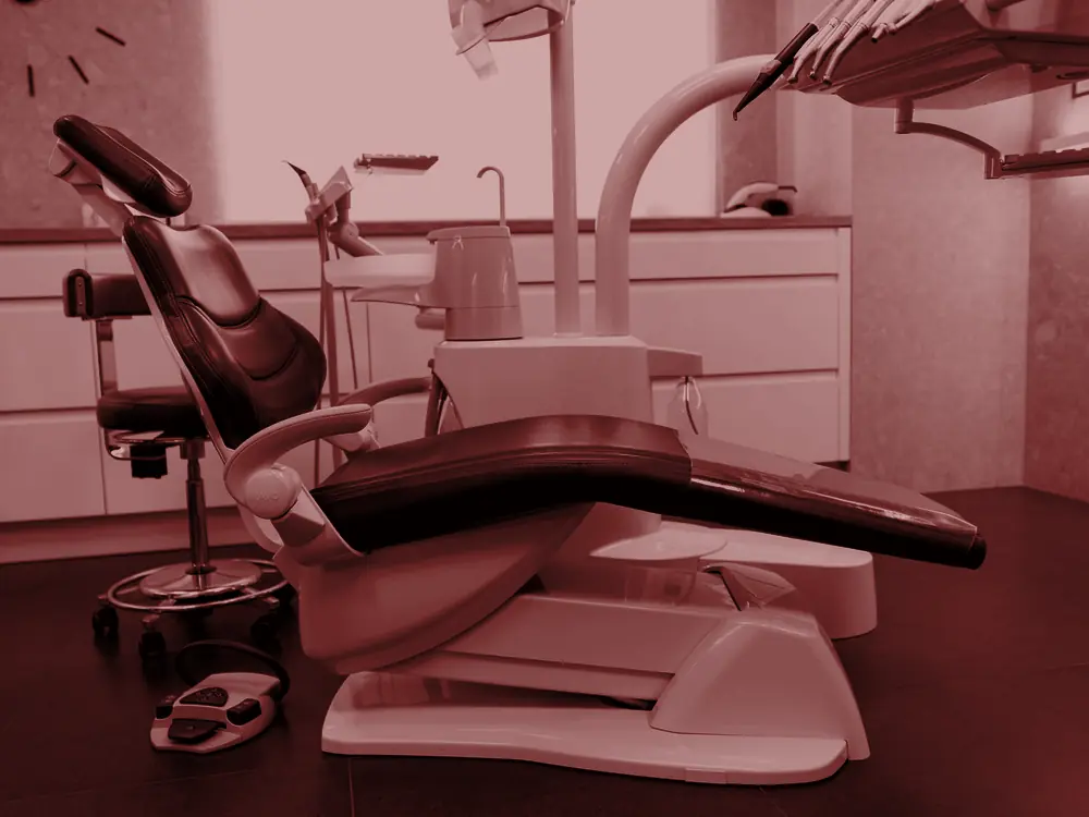Dental clinic room with chair and equipment