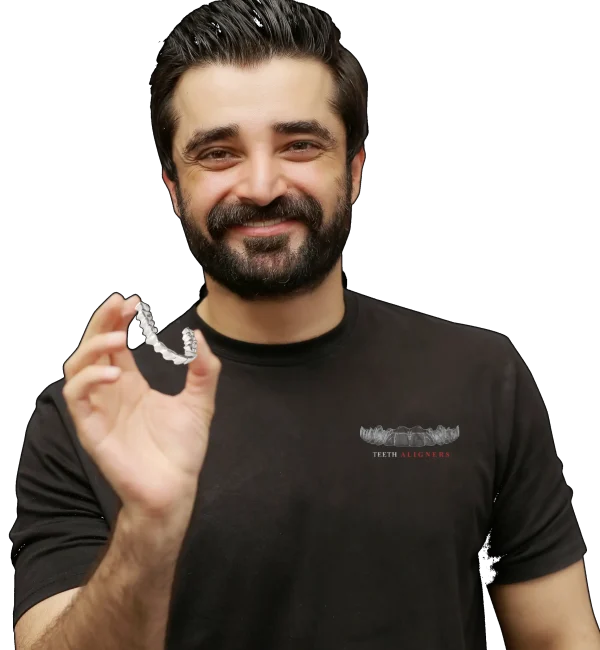 Pakistani Renowned Filmstar Hamza Ali Abbasi holding our teeth aligners Product